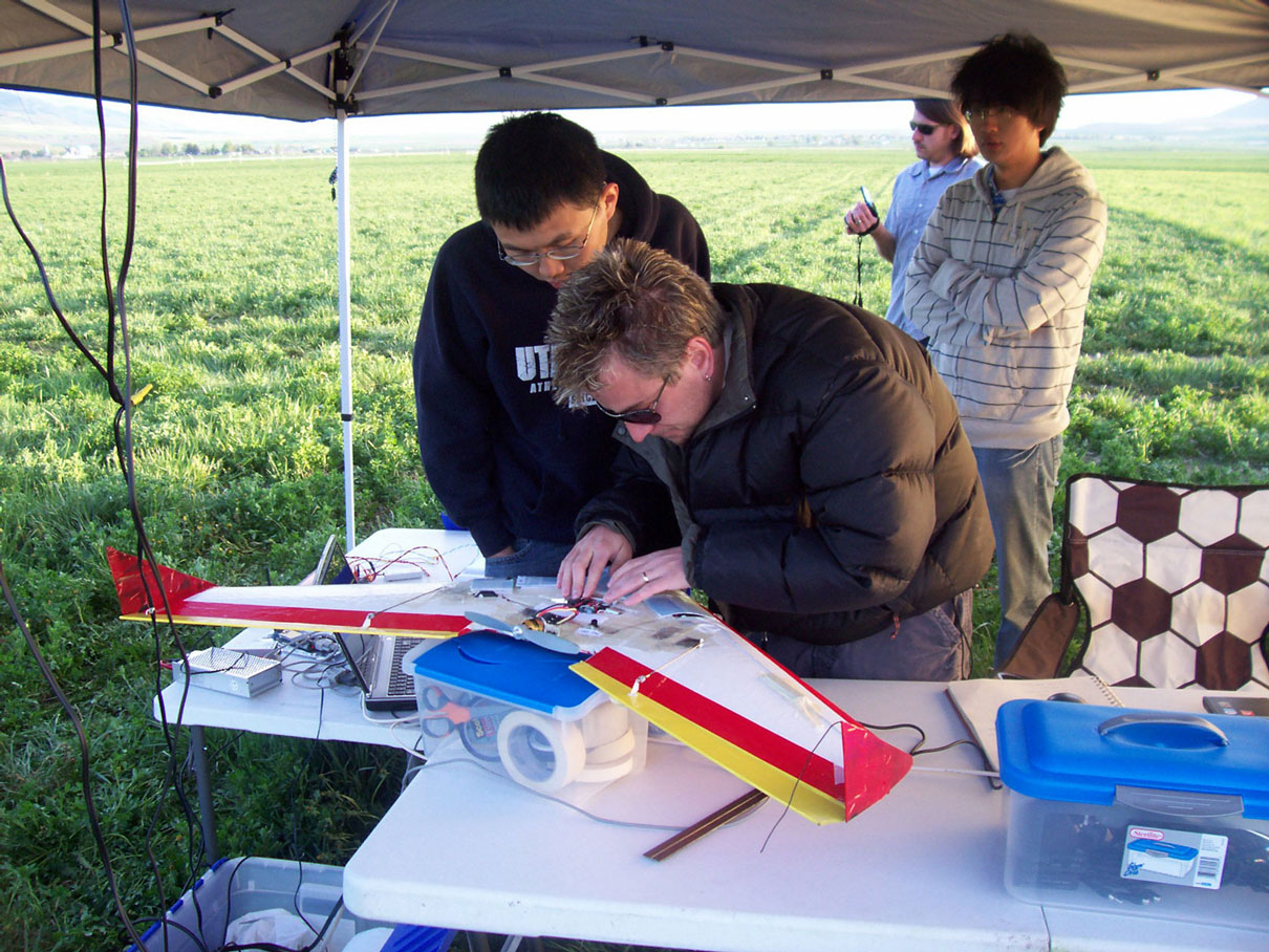 AggieAir team fixing a UAV